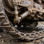 Bulldozer track tension wrong. 1 grease adjustment prevents track derailment.