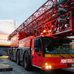 Liebherr mobile crane installs inflatable mountains on Paris’ Pont-Neuf bridge
